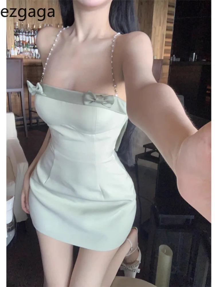 WARMMETA Mini Dresses Women Sleeveless Bowknot Chain Backless Spring Summer Slim French Style Elegant Dress Sweet Sexy Ladies